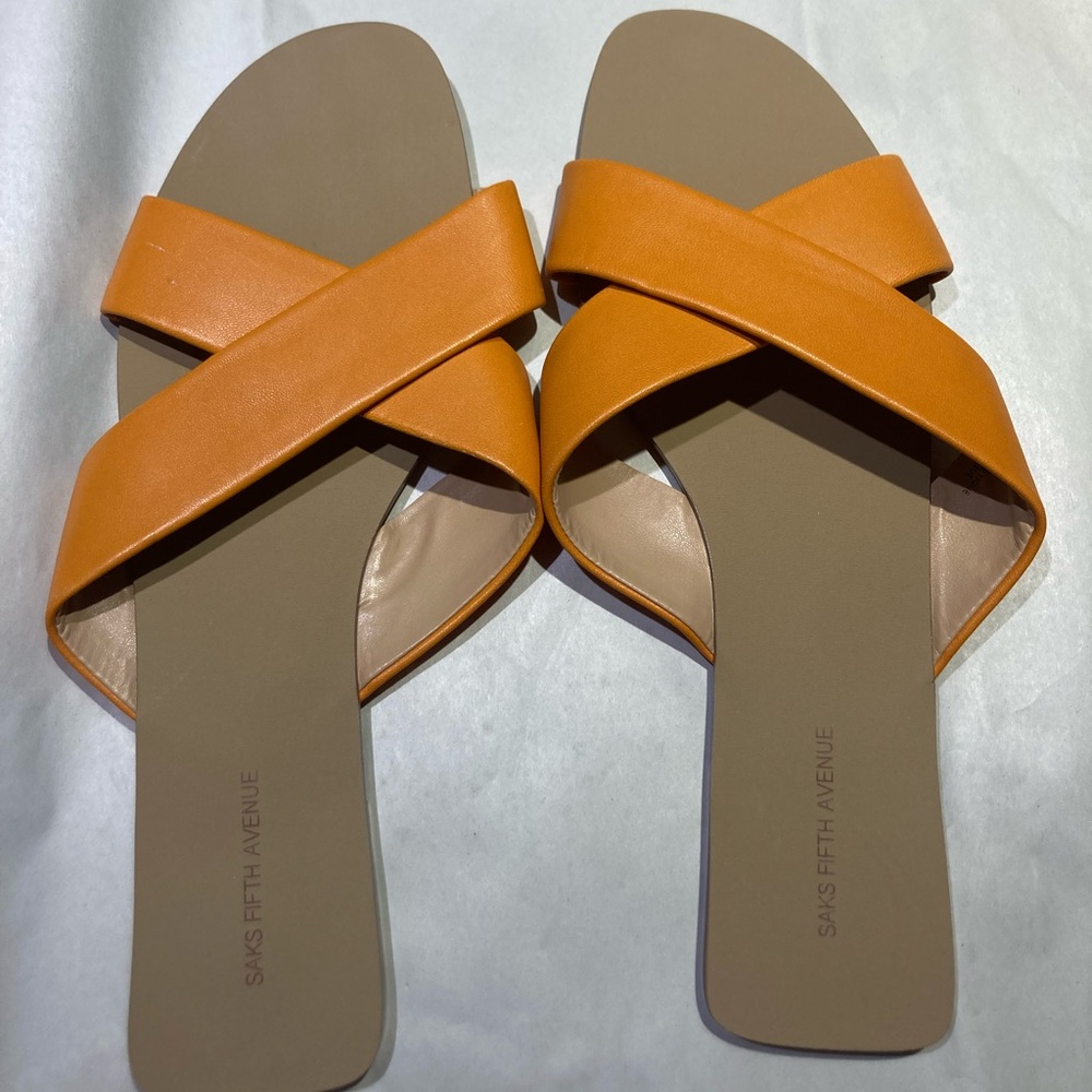 Saks orange leather slides